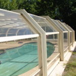 Retractable glass pool enclosure