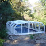 Residential retractable pool enclosure