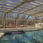 Retractable glass pool enclosure