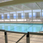 Retractable pool enclosures for condos