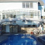 Retractable residential pool enclosure