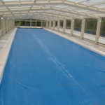 Retractable pool enclosures