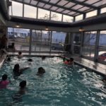 Retractable hotel pool enclosure
